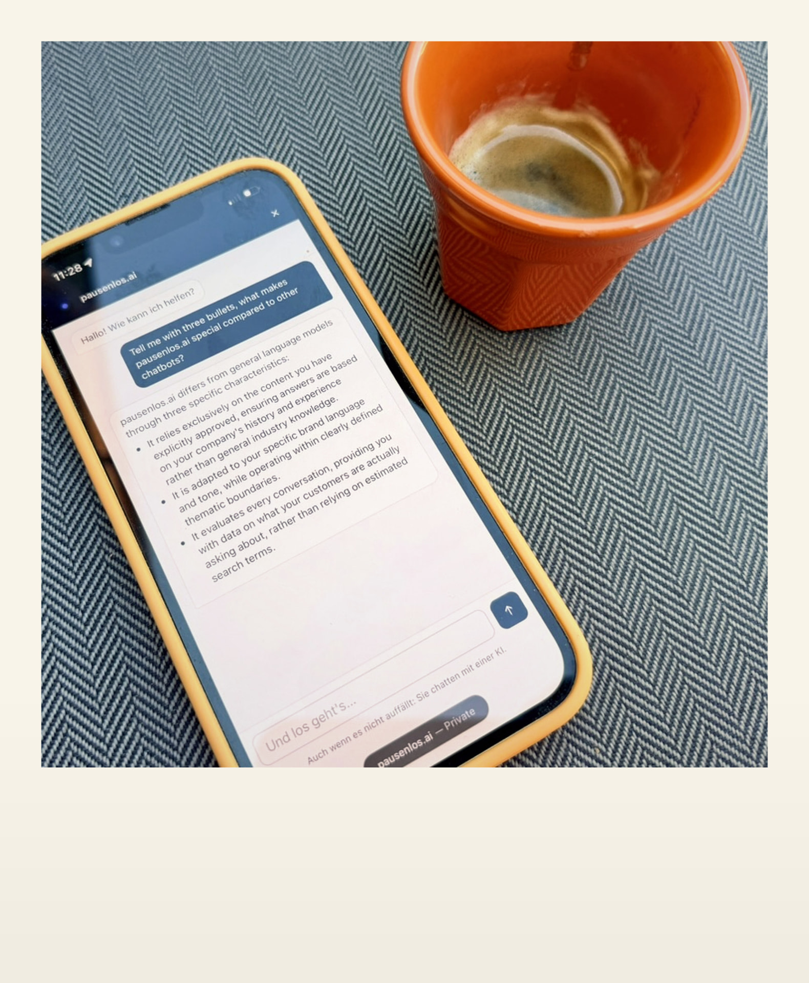 pausenlos.ai chat on a phone next to an espresso cup